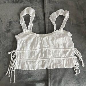 White Smocked Crop Top with Ruffled Sleeves and Side Tie Detail